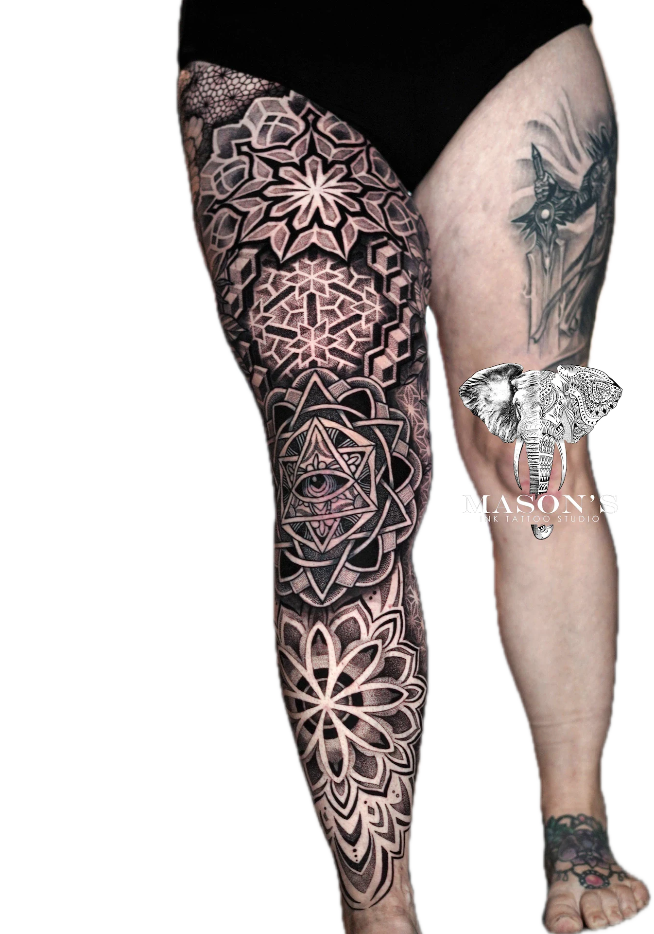 Mandala Tattoo Design: Intricate mandala and elephant leg tattoo with geometric patterns