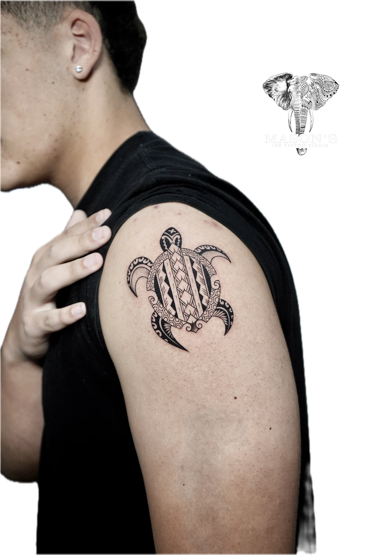 Fine Line Turtle Tattoo Design: a stylized turtle with geometric patterns and moons on the upper arm