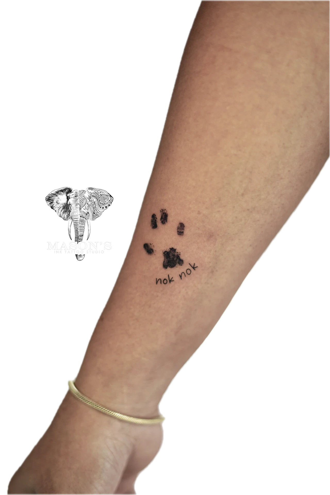 Fine Line Tattoo Design: Small paw print with lettering on the calf