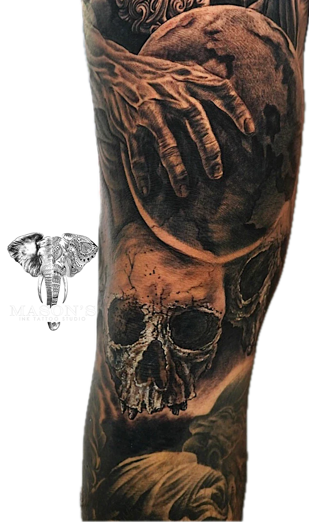 Black and Grey Skull and World tattoo by Mason's Ink Tattoo Studio, Bali