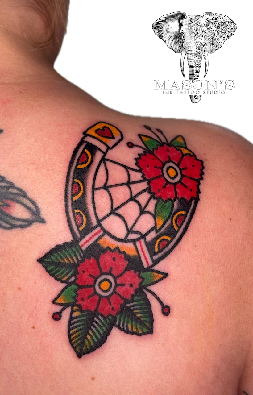 Traditional Horseshoe and Spider Web Floral Tattoo Design - American Traditional tattoo by Mason's Ink Tattoo Studio, Bali