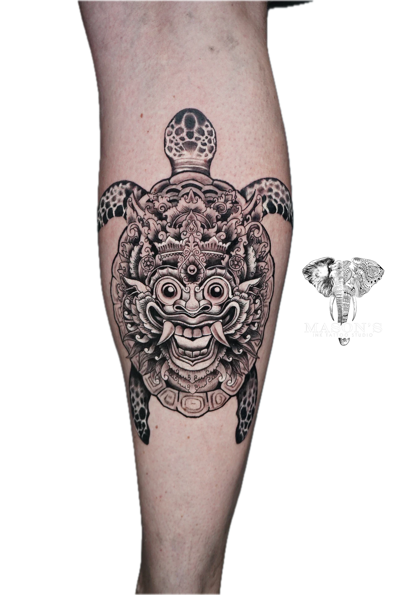 Balinese Barong and Turtle Tattoo Design: a detailed turtle shell with a mythological face design on a thigh