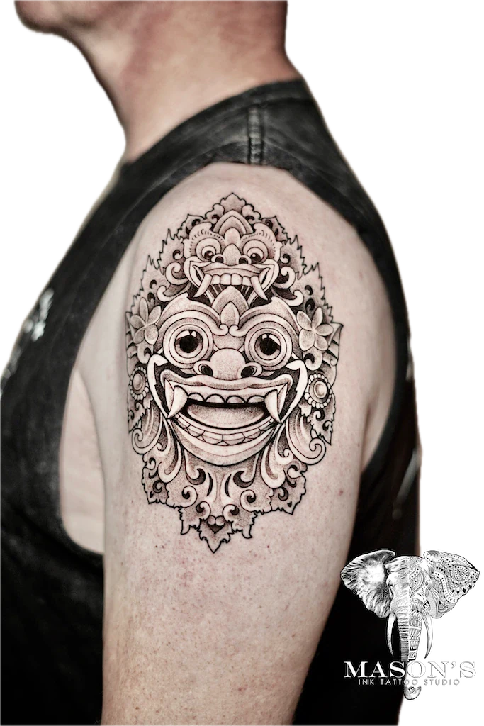 Traditional Barong Tattoo Design: a detailed balinese mask tattoo with intricate floral patterns