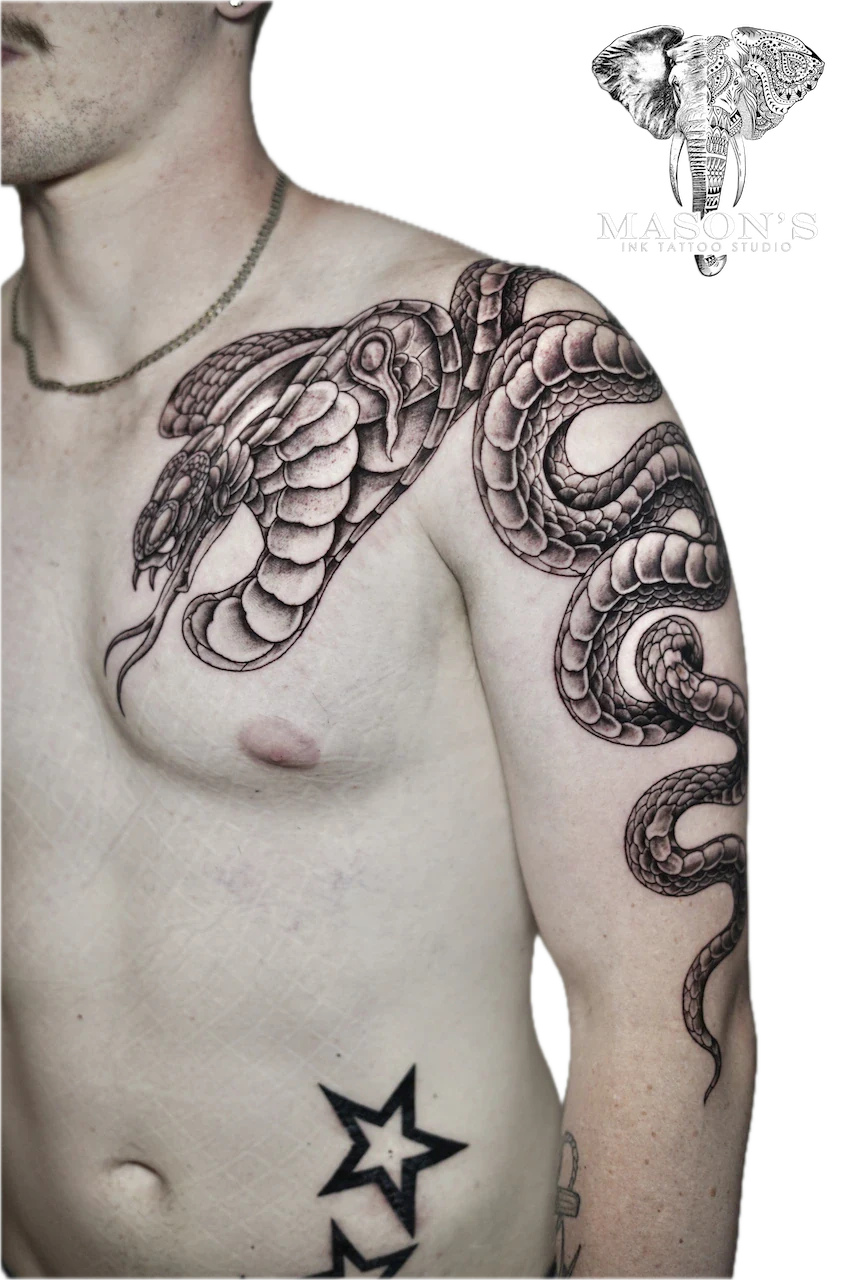 Black and Grey Snake Tattoo Design: a large snake tattoo wrapping around the upper arm