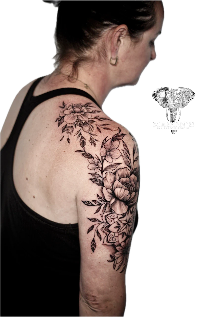 Black and Grey Floral Flower Tattoo Design: a large floral and mandala design on the upper arm