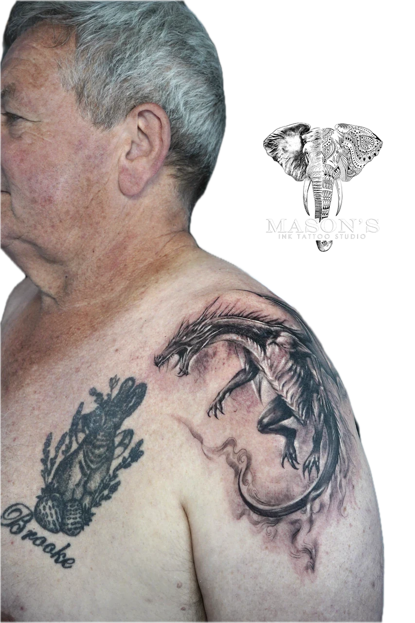 Black and Grey Dragon Tattoo Design: a dragon and crab tattoo on the shoulder with lettering