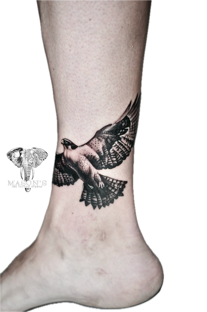 Black and Grey Eagle Tattoo Design: a detailed bird tattoo on the ankle