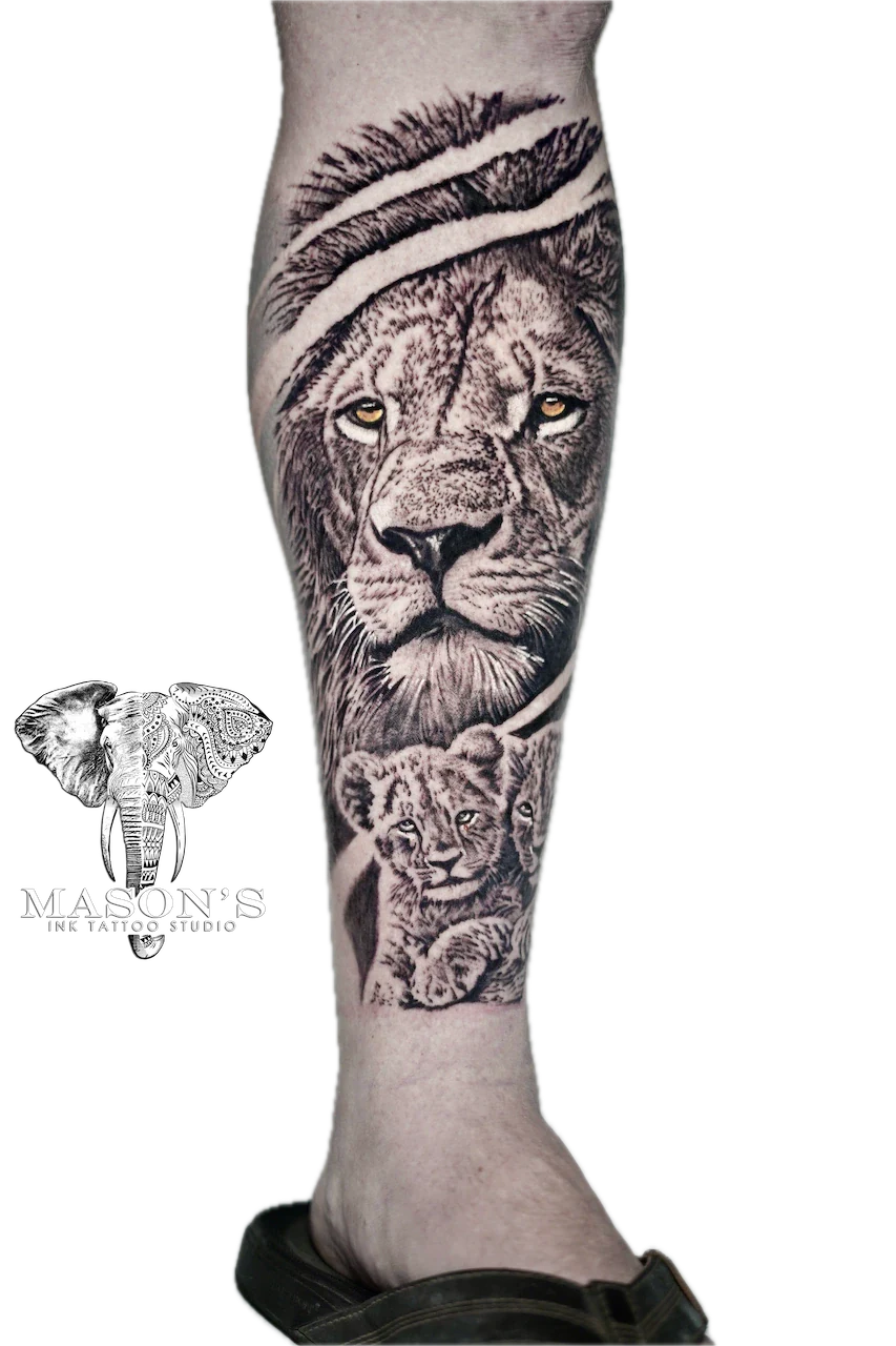 Black and Grey Lion Tattoo Design: a large black and grey lion and cub calf tattoo with feathers