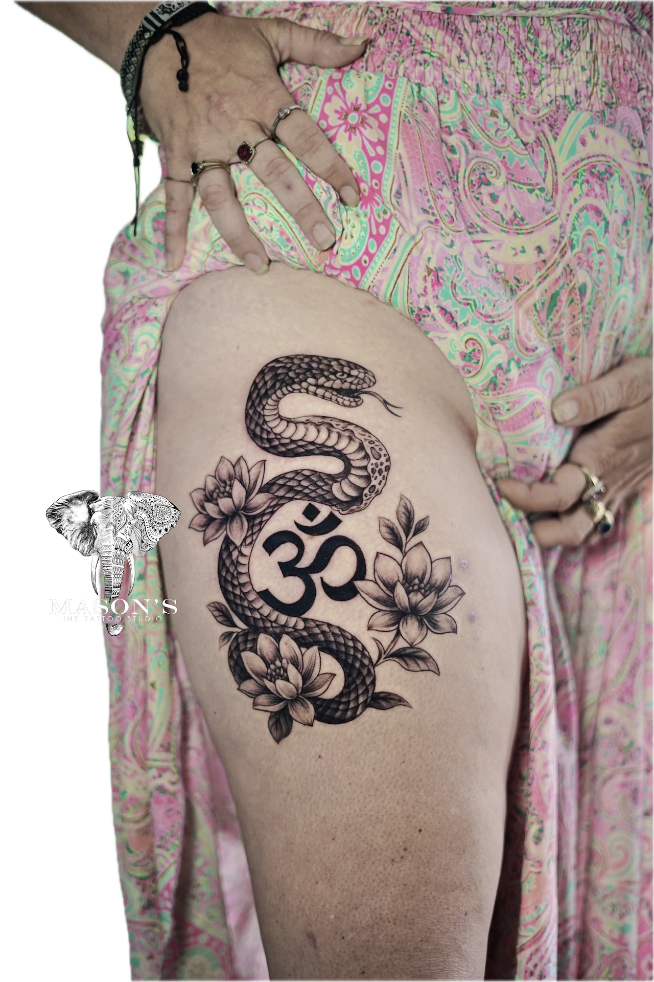 Traditional Black Work Dragon Tattoo Design: a snake wrapped around a lotus and the om symbol