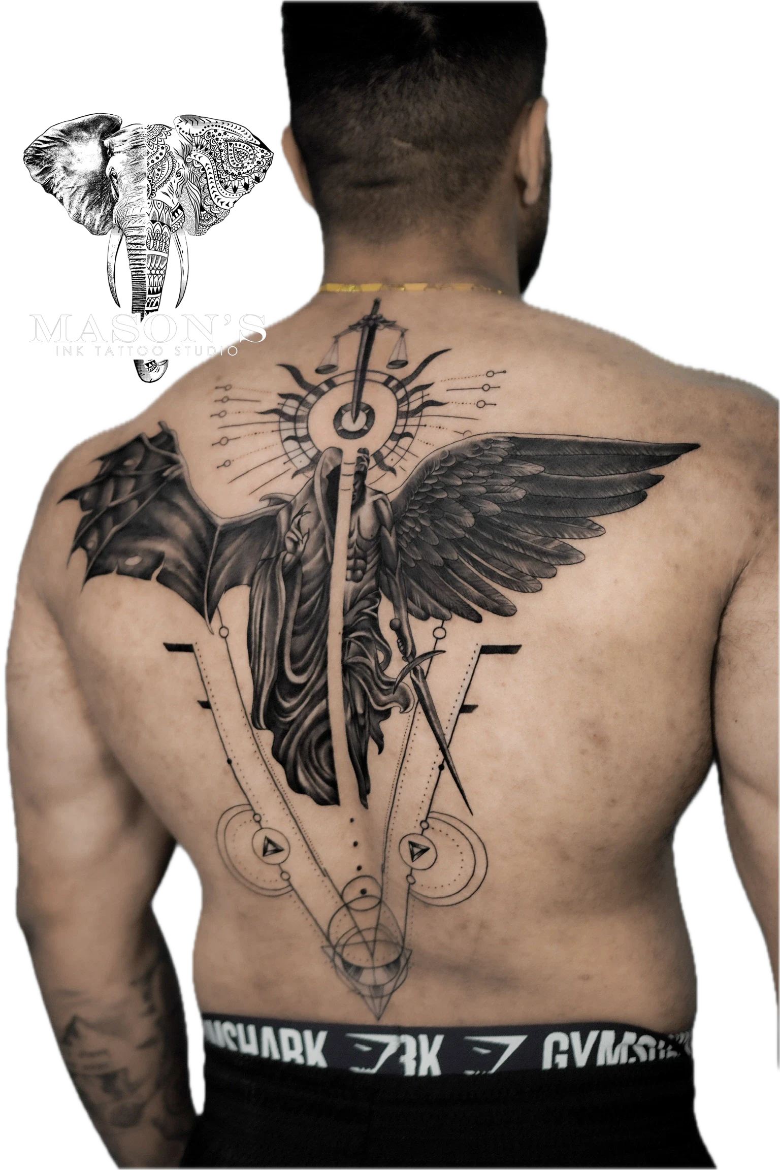 Black and Grey Realism Angel and Demon Tattoo Design: a large angel with wings and a sword on the back