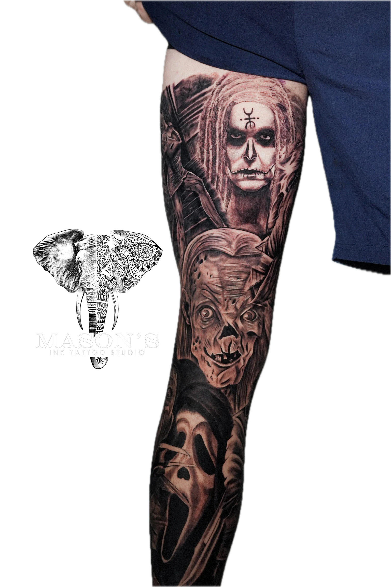 Black and Grey Realism Tattoo Design: a full sleeve tattoo of dark, mythological faces and skulls
