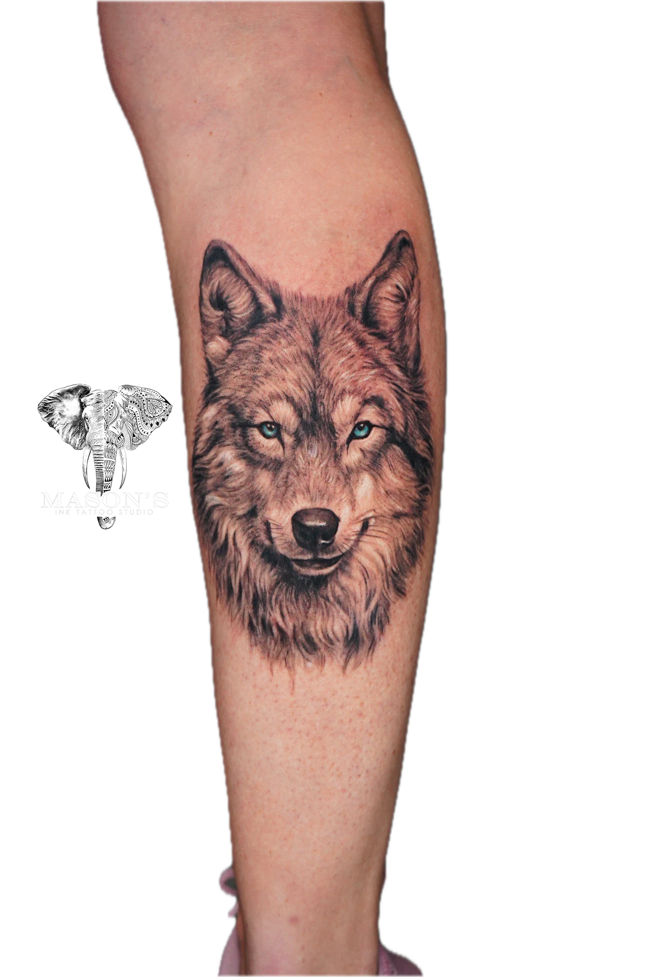 Black and Grey Realism Wolf Tattoo Design: a detailed wolf portrait on the calf