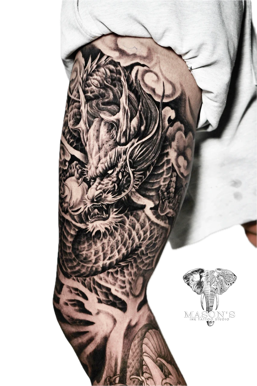 Black and Grey Dragon Tattoo Design: a detailed dragon and wolf on a tree in a mountainous landscape