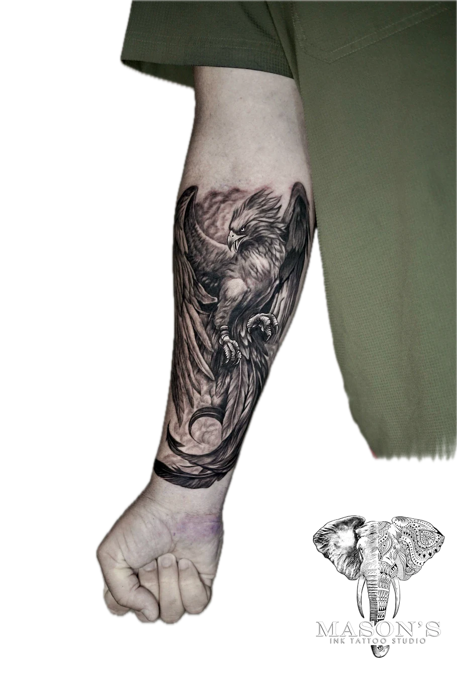 Black and Grey Eagle Tattoo Design: a detailed eagle and owl tattoo with a moon and waves on a forearm