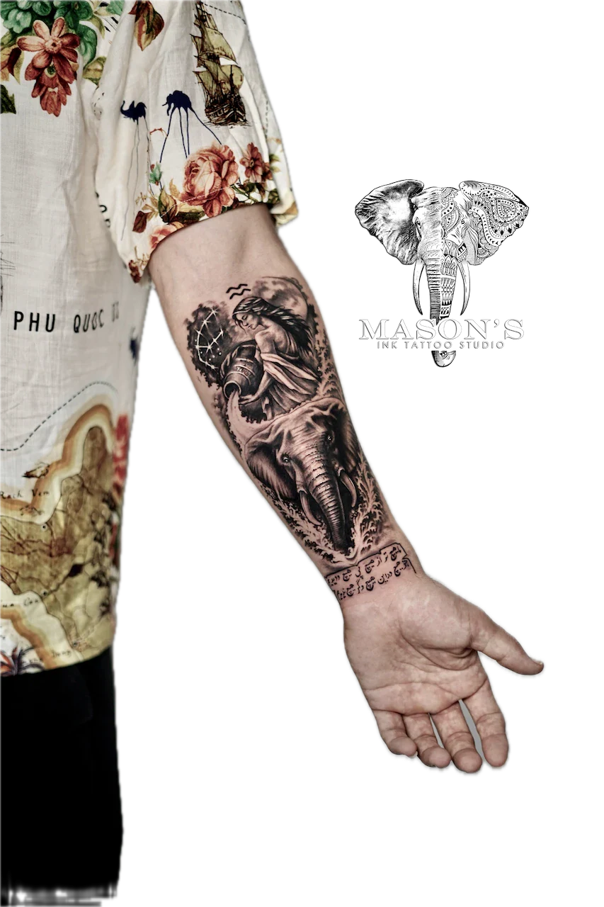 Black and Grey Elephant Tattoo Design: a detailed forearm tattoo of an elephant with a compass and portrait