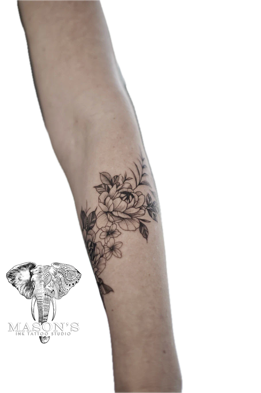 Black and Grey Floral Arm Tattoo Design: a delicate black and grey floral tattoo on the forearm