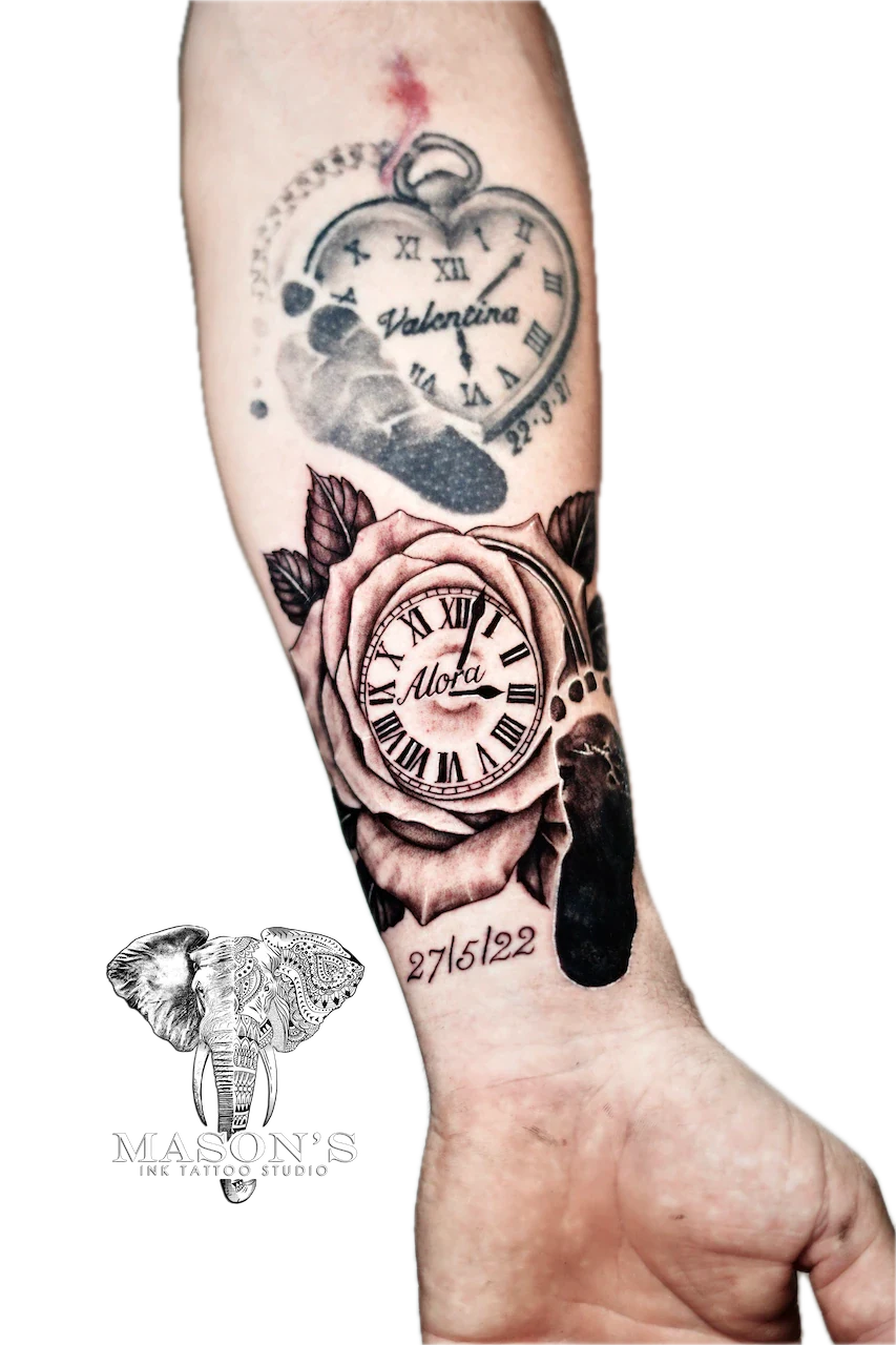 Black and Grey Floral Script Tattoo Design: Two clock roses with names and a date on the forearm