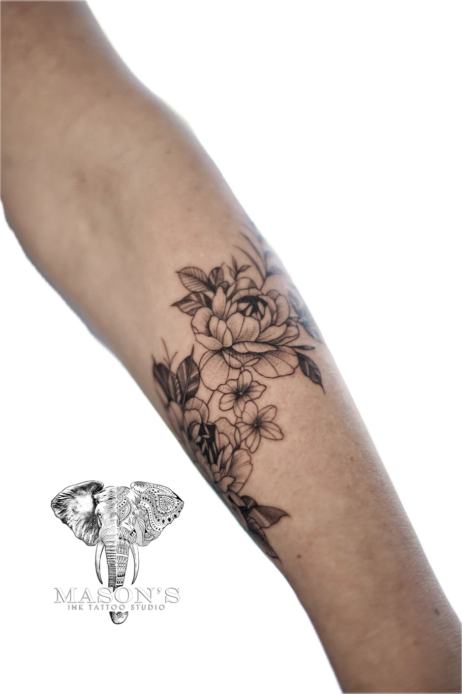 Black and Grey Flower Arm Tattoo Design: a detailed black and grey floral tattoo on the forearm