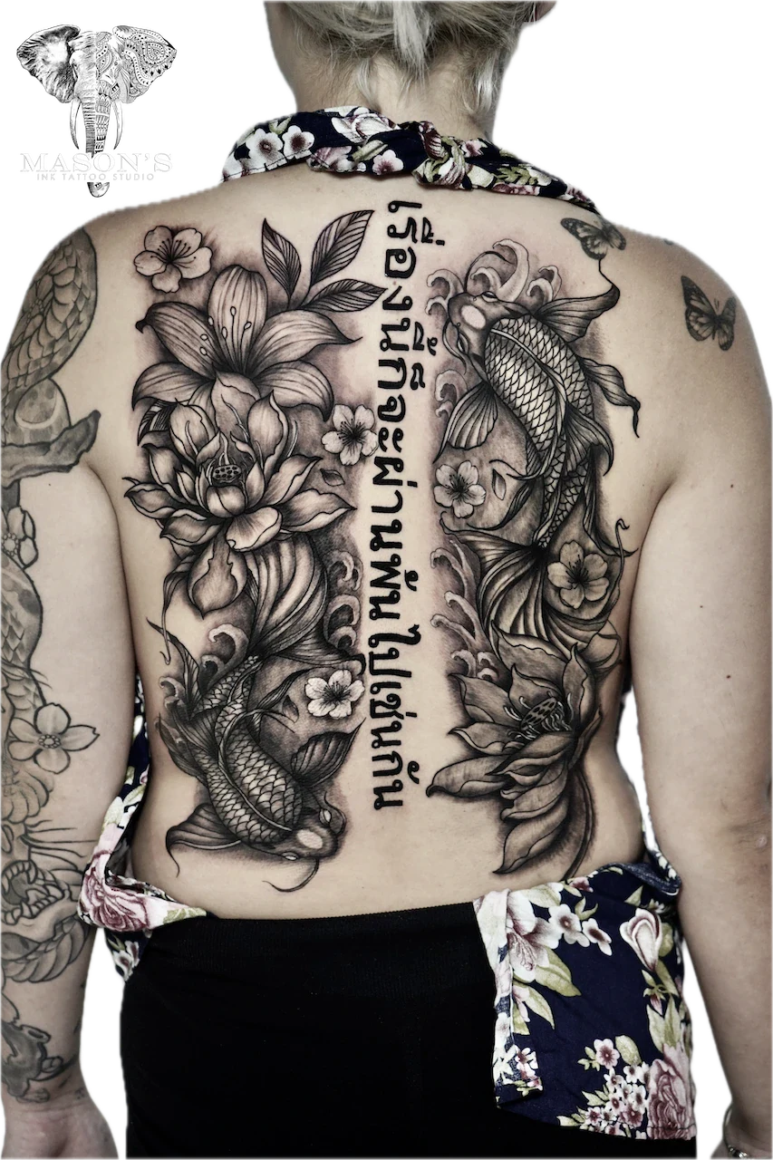 Black and Grey Japanese Koi Fish and Flower Tattoo Design by Mason's Ink Tattoo Studio, Bali