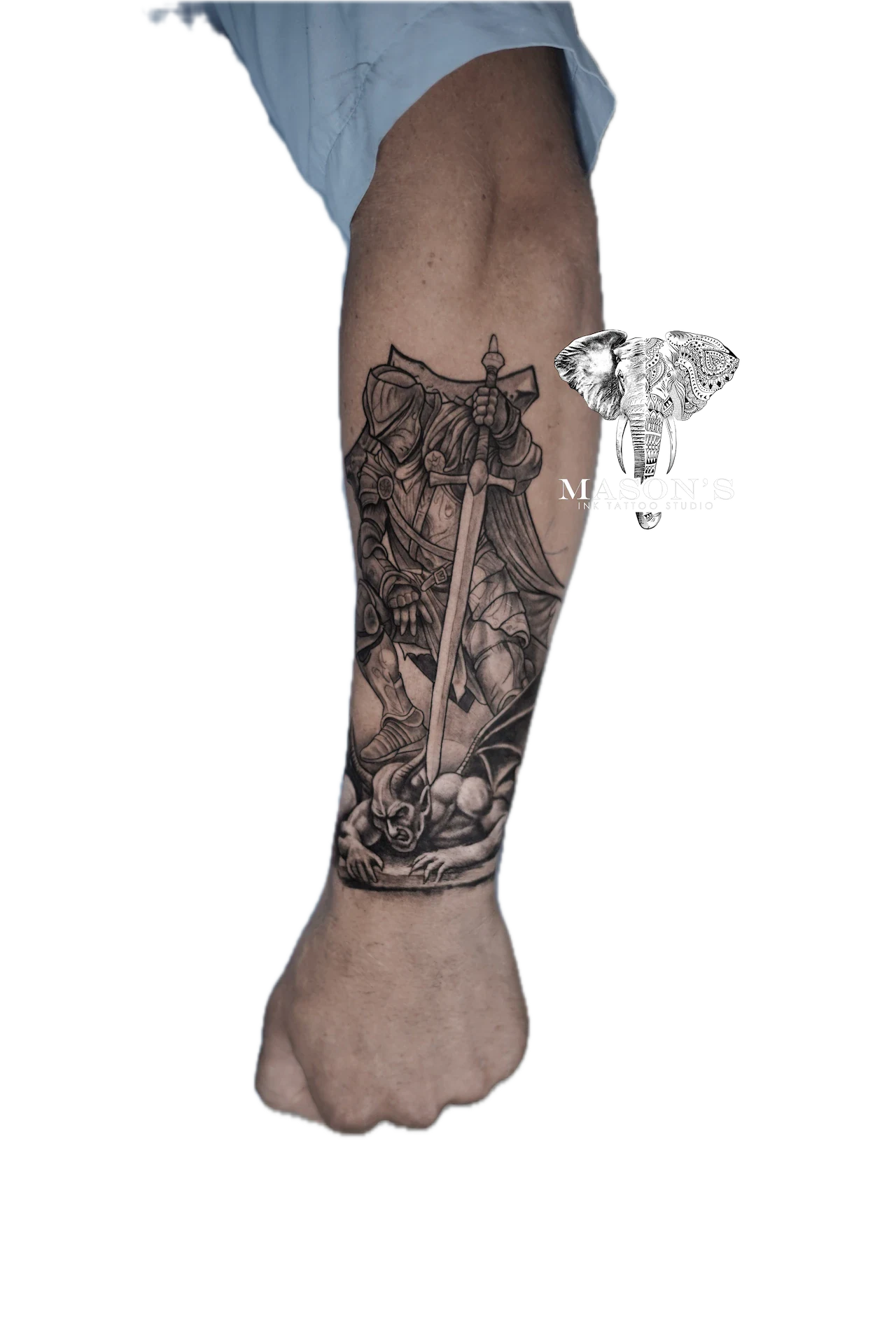 Black and Grey Tattoo Design: a detailed forearm tattoo of an angel holding a sword and skull
