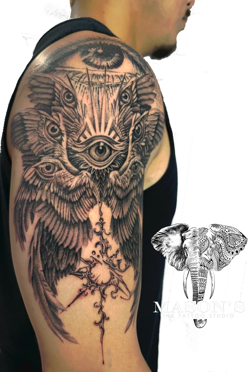 Black and Grey Realism Wings and Eye Tattoo Design by Mason's Ink Tattoo Studio, Bali