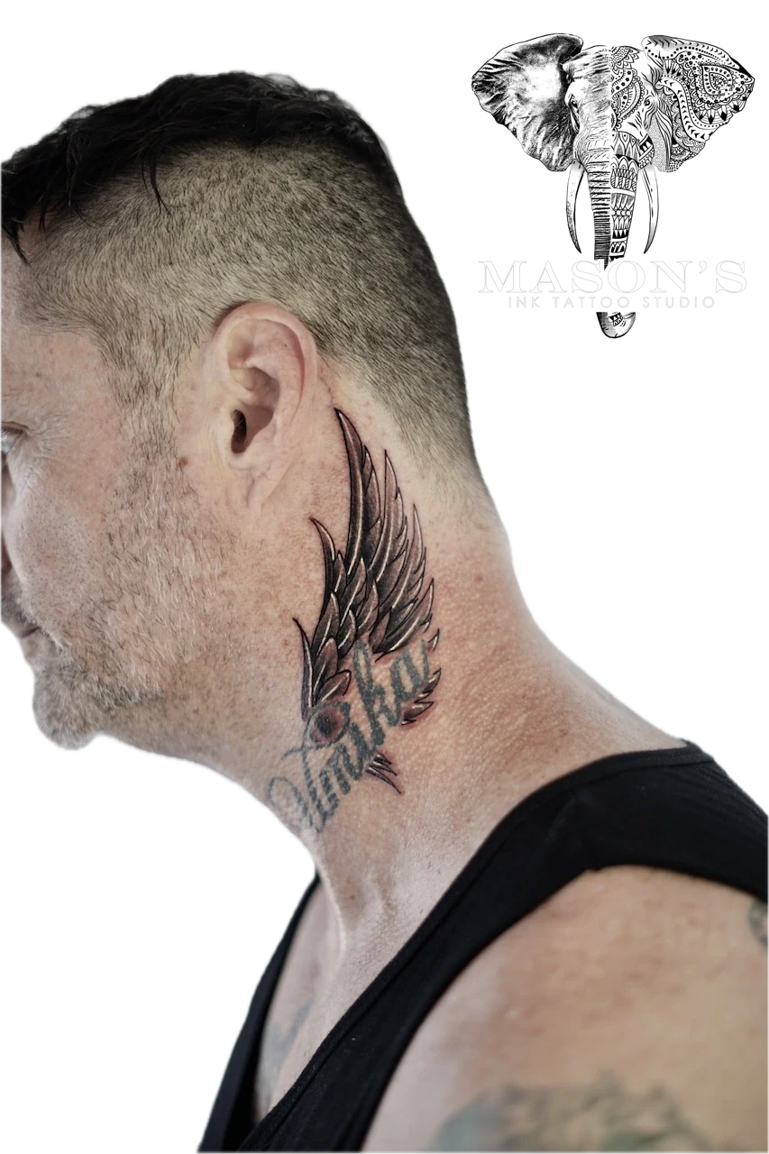 Black and Grey Wing Tattoo Design by Mason's Ink Tattoo Studio, Bali