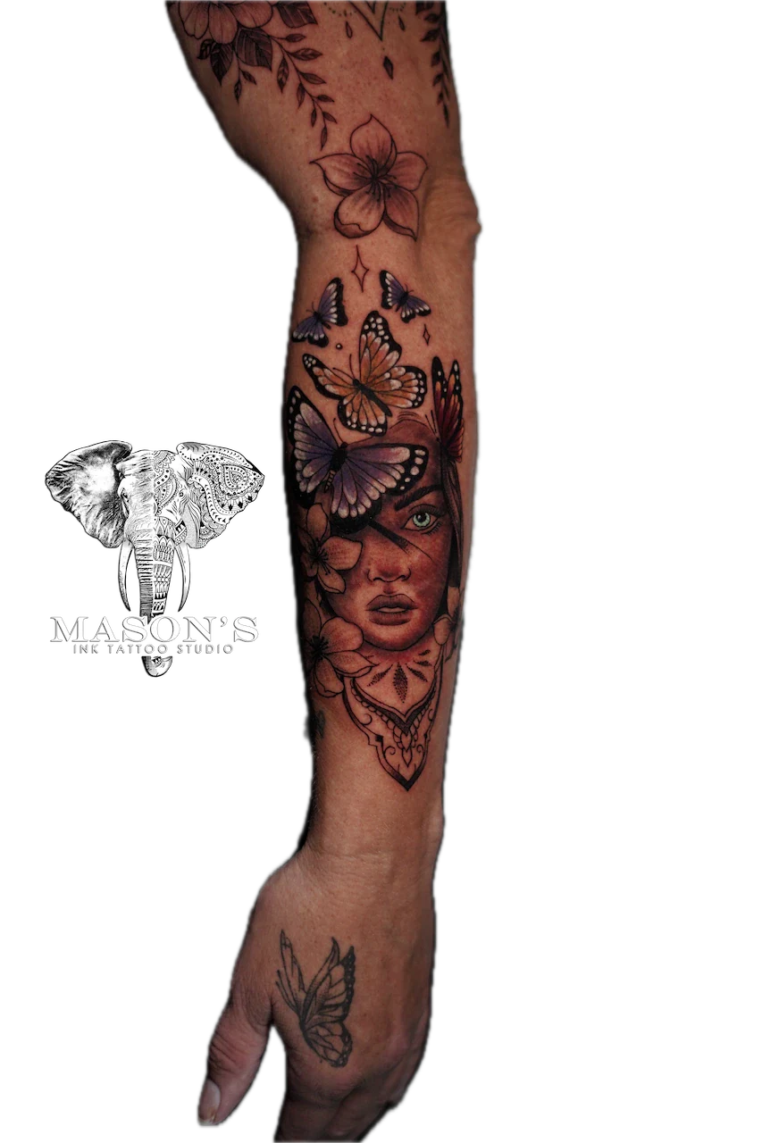 Black and Grey Woman Floral Butterfly Tattoo Design: a large forearm tattoo of a portrait with butterflies and flowers