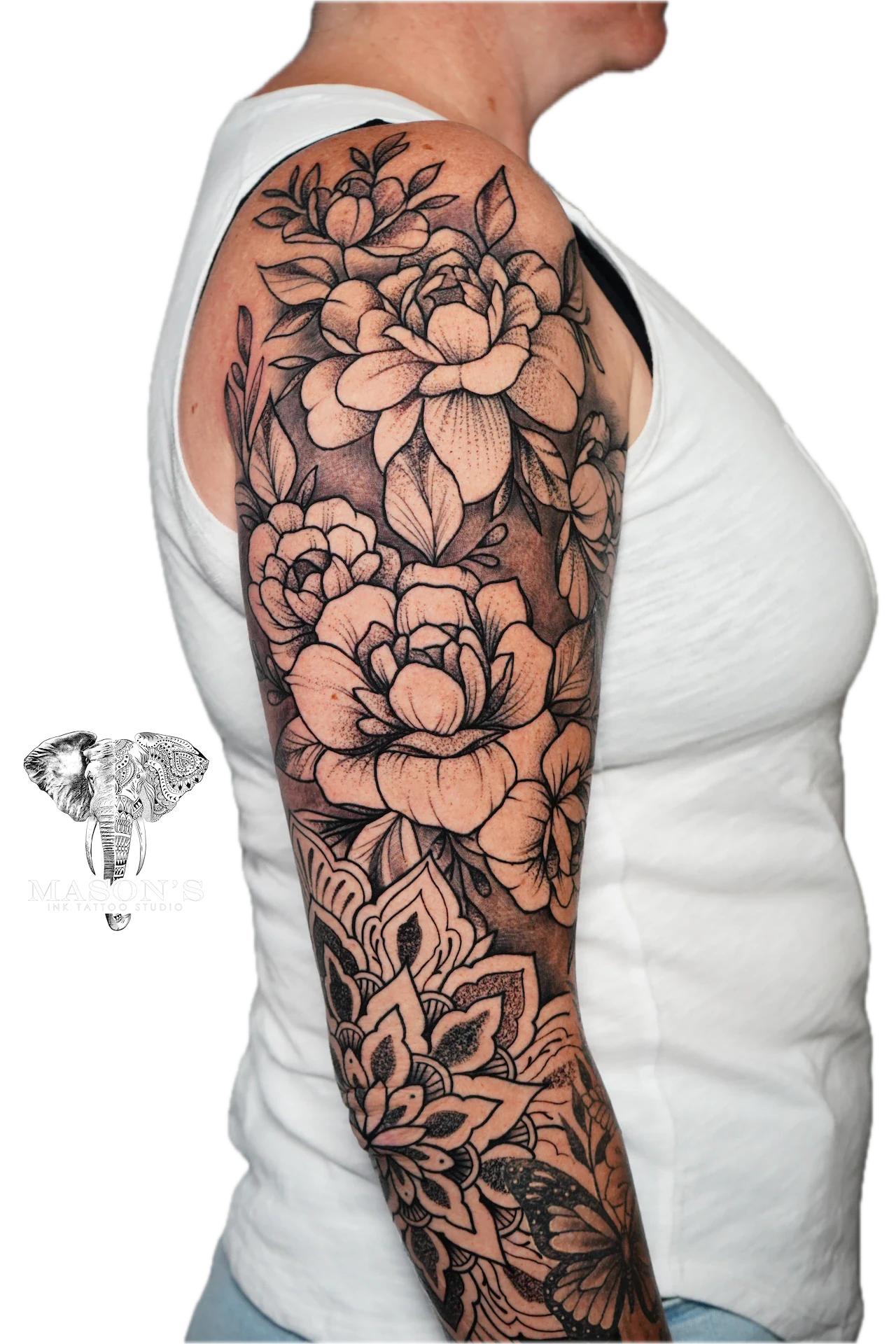 Black and Grey Floral Tattoo Design: a large floral sleeve tattoo with intricate details