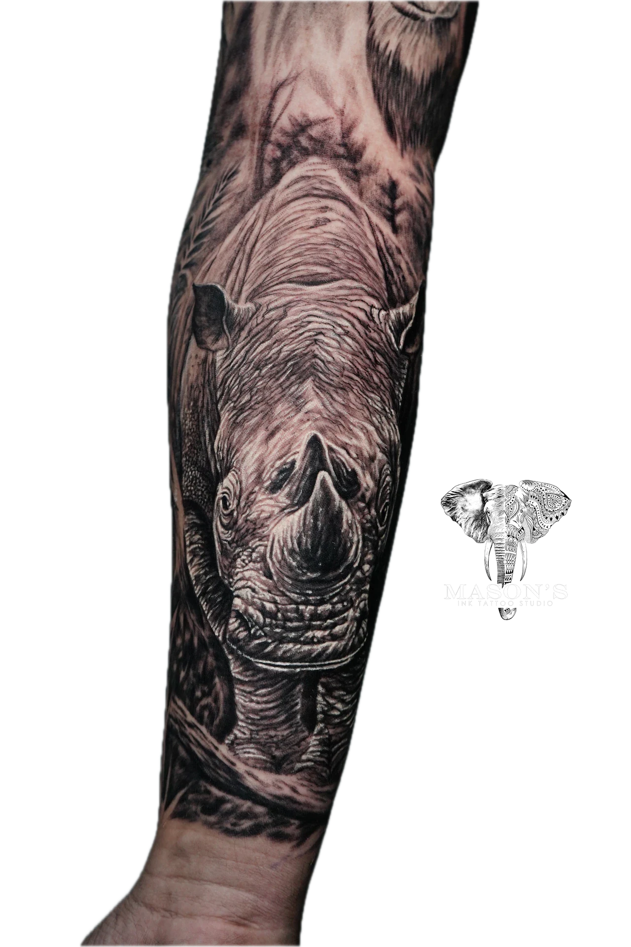 Realism Tattoo Design: a detailed black and grey elephant tattoo on a forearm