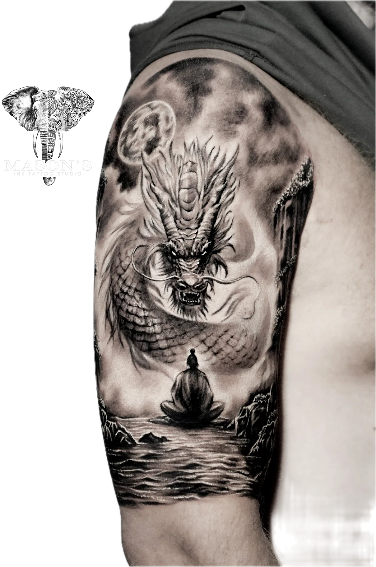 Black and Grey Realism Dragon Tattoo Design: a fierce dragon looming over a meditating person in a serene landscape