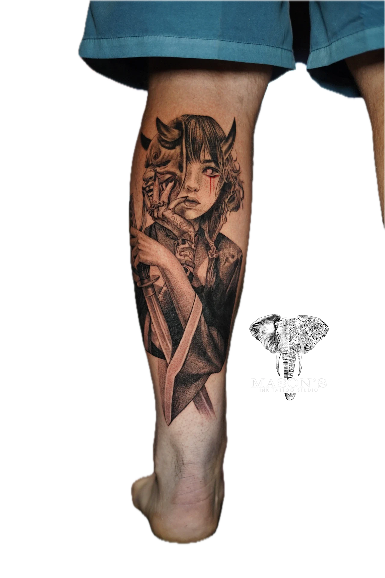 Black and Grey Japanese Woman Tattoo Design: a dark portrait of a girl with horns on a calf