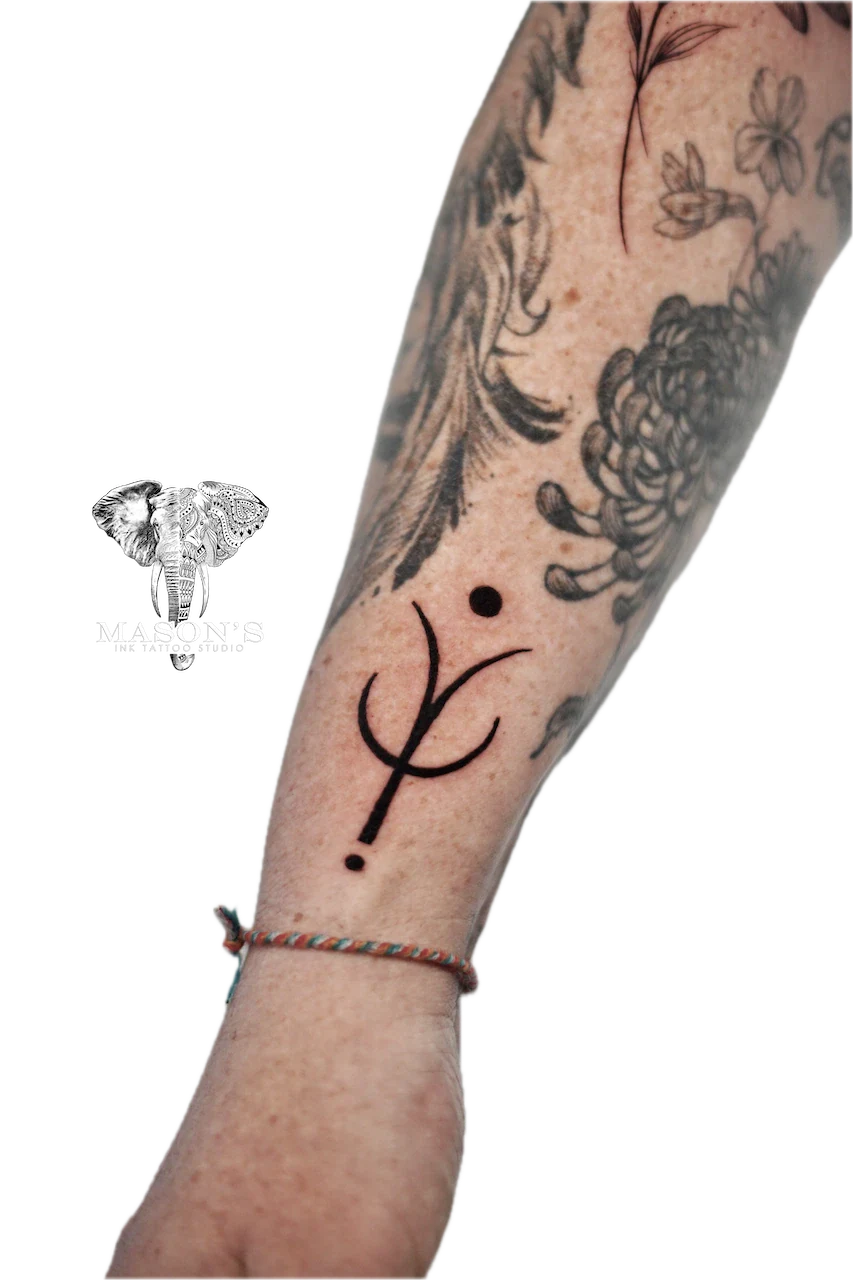 Black Work Tattoo Design: Minimalist geometric pattern with feathers and flowers on the forearm