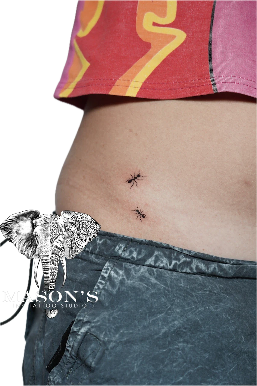Black Work Tattoo Style Ant: Two small ants and an elephant on the hip