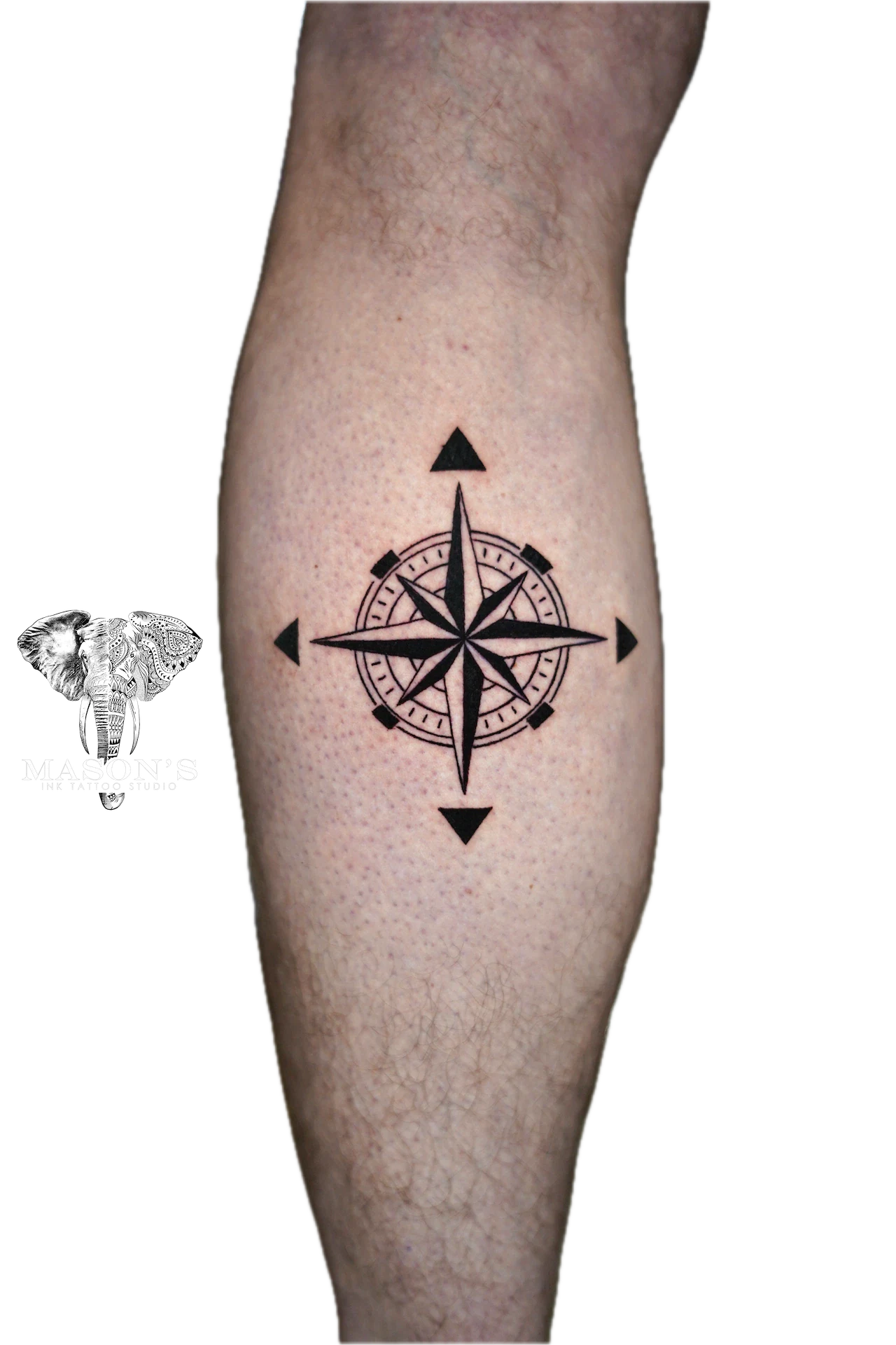 Black Work Tattoo Style : Compass: a minimal compass tattoo with arrows on a calf