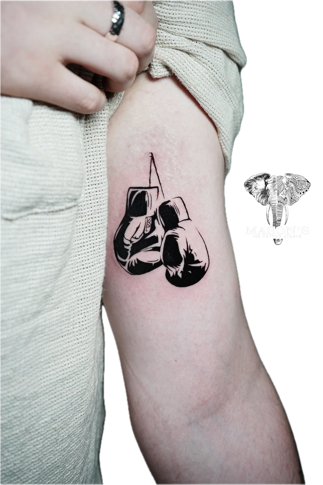 Black Work Tattoo Style : Silhouette Boxer: a minimalist tattoo of Winnie the Pooh with a honey pot