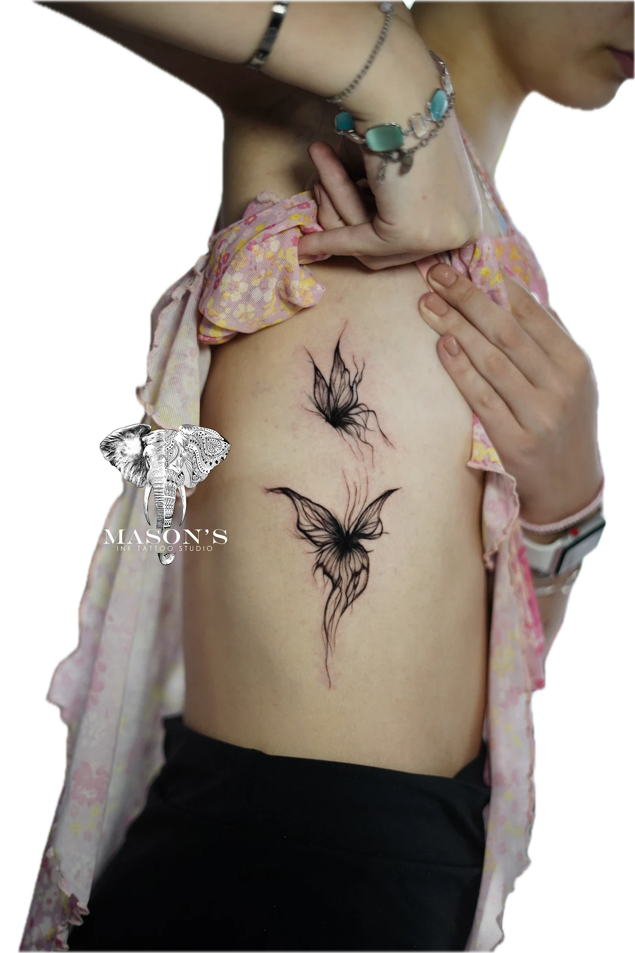 Black Work Tattoo Style : Butterfly: Two butterfly tattoos with feather details on the stomach