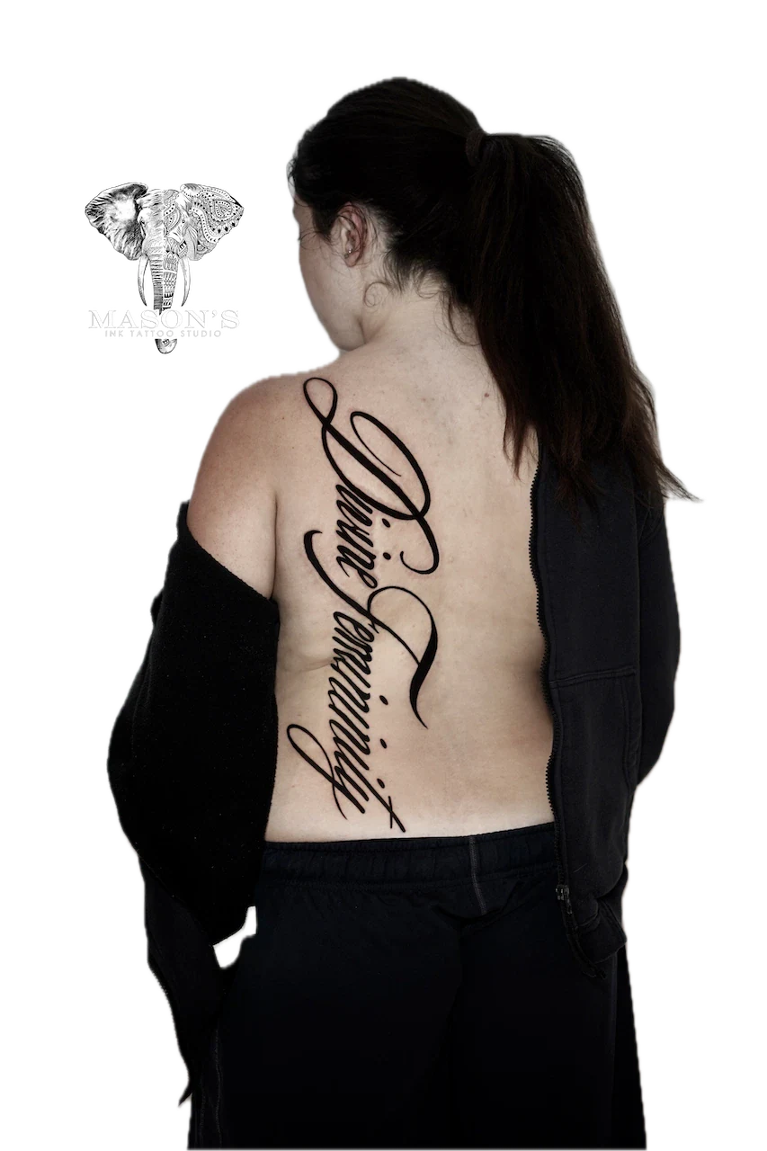 Blackwork Bold Script Tattoo Design: Large elegant lettering on the back