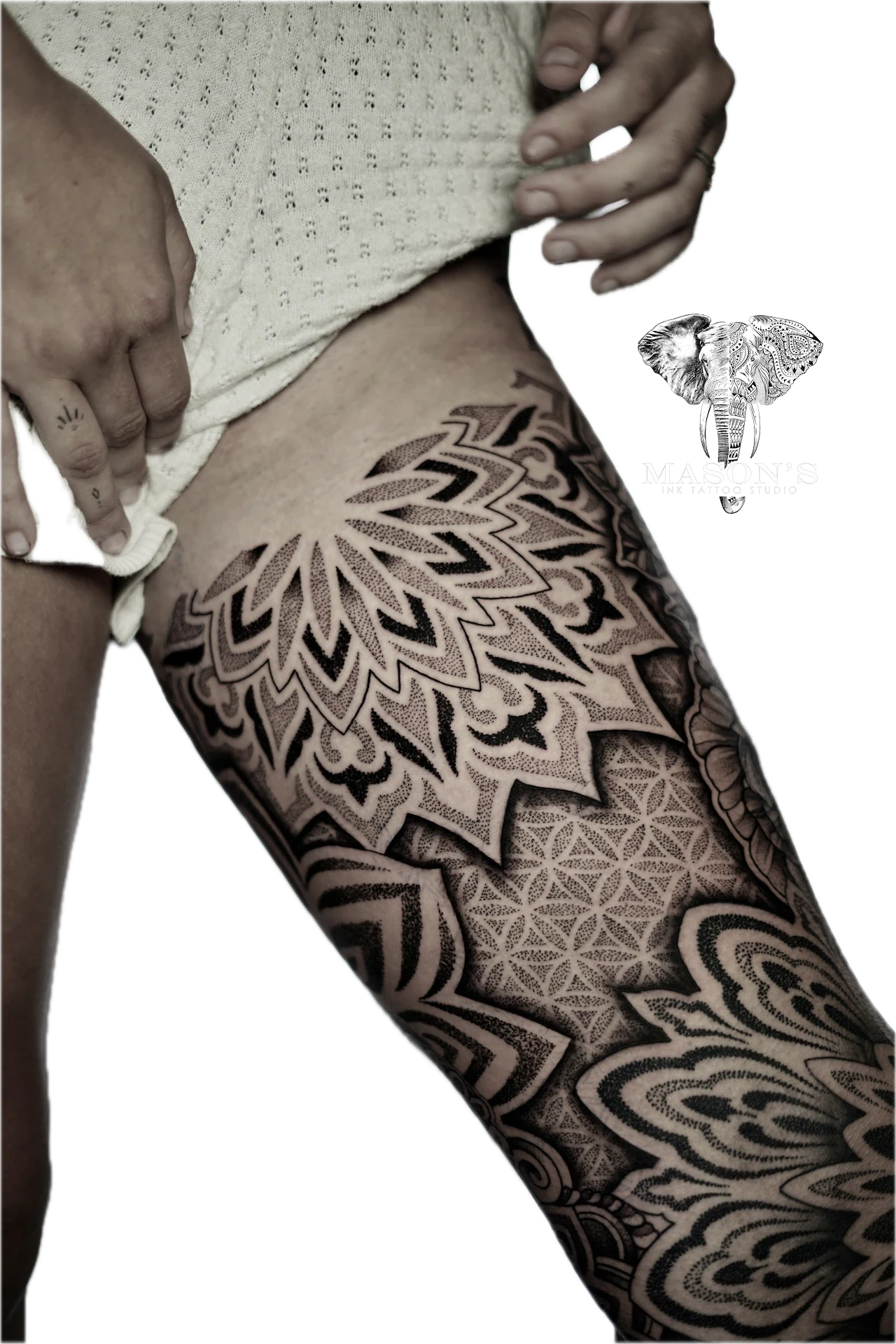 Black Work Mandala Tattoo Design: Intricate geometric and mandala thigh tattoo with waves and fish