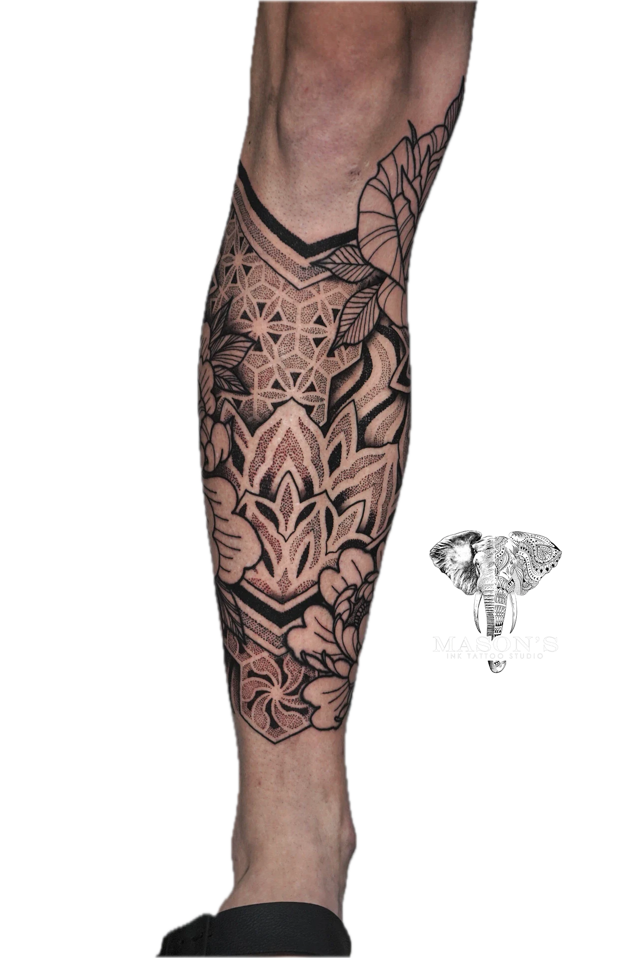 Black Work Mandala Tattoo Design: Intricate geometric pattern and leaf designs on the calf