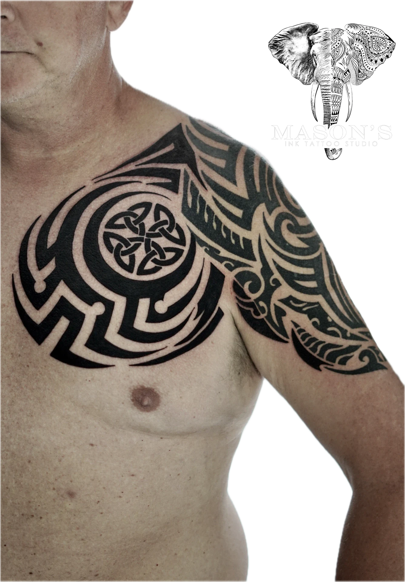 Black Work Tribal Tattoo Design: a large black and grey geometric pattern with a central knot design