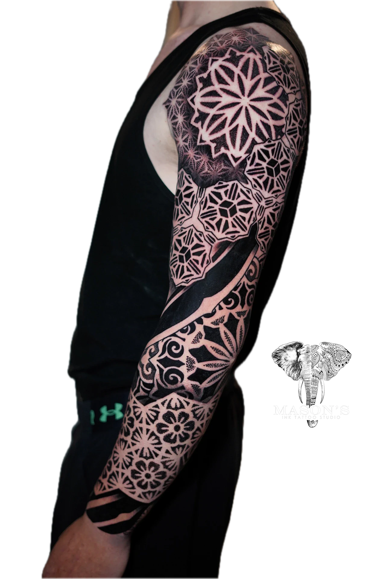 Black Work Mandala Tattoo Design: a full sleeve tattoo of intricate geometric and floral patterns