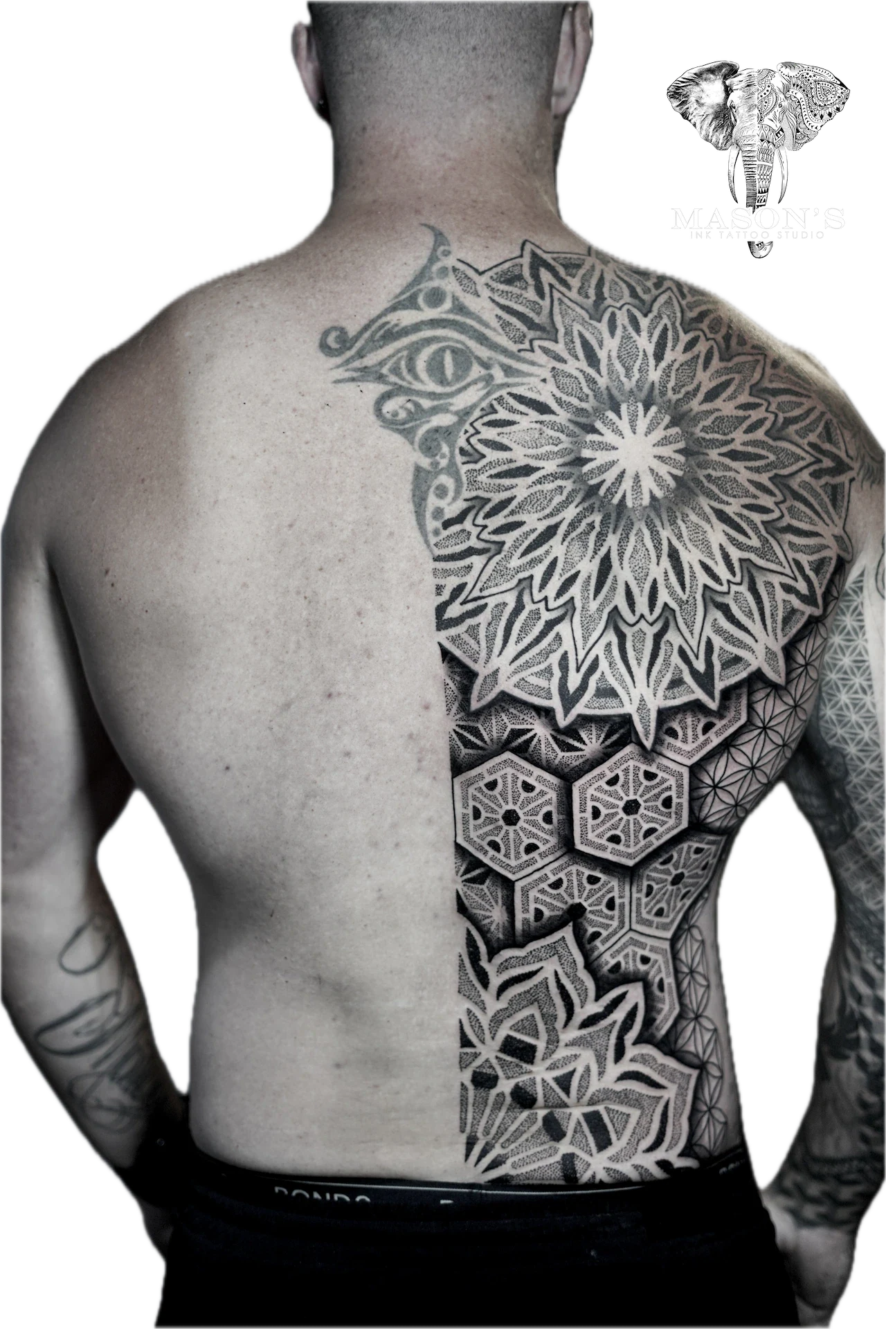 Mandala & Black Work Tattoo Design: Intricate mandala and geometric pattern on the back
