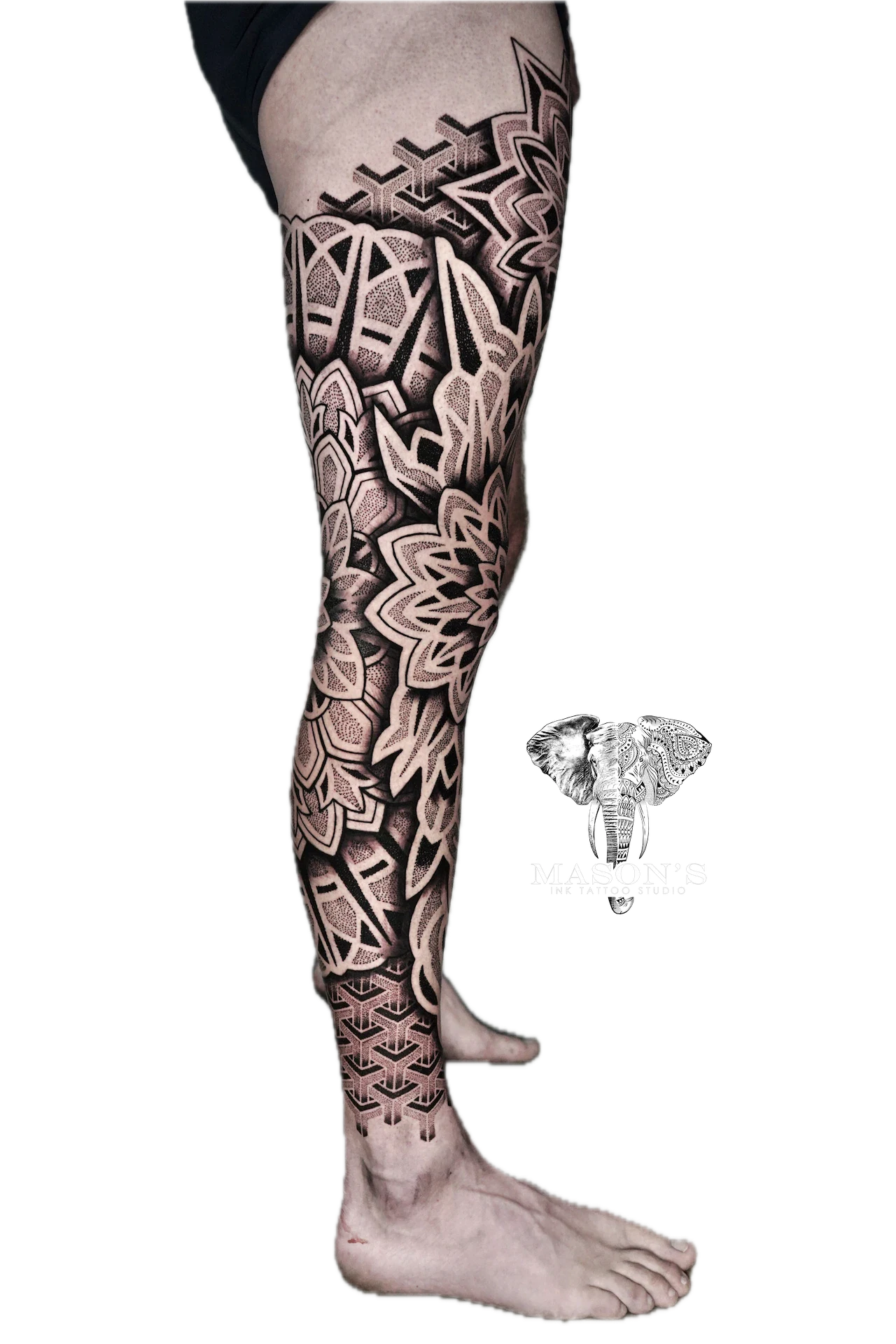 Mandala and Black Work Tattoo Design: Intricate geometric pattern covering the entire leg
