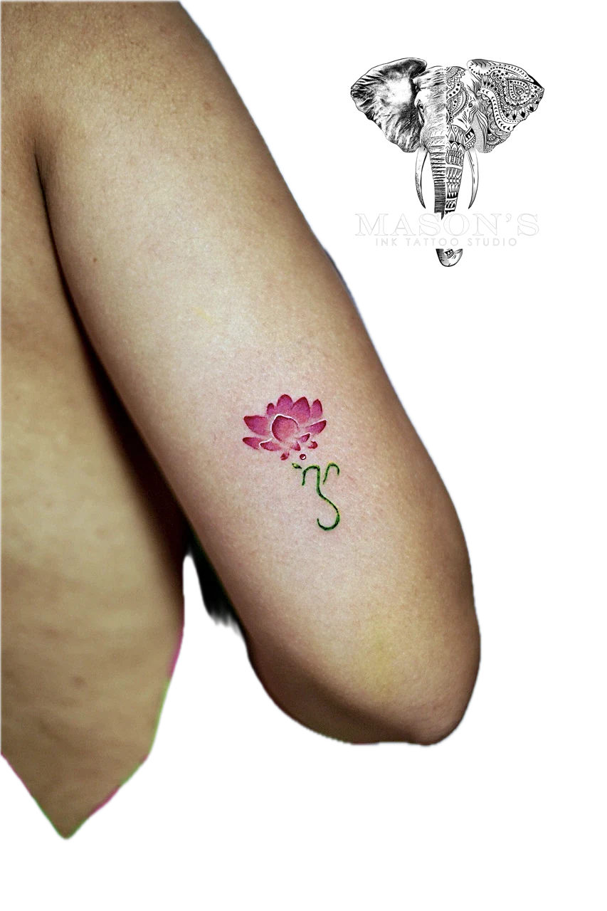 Color Floral Tattoo Design: a small pink lotus with lettering on the forearm