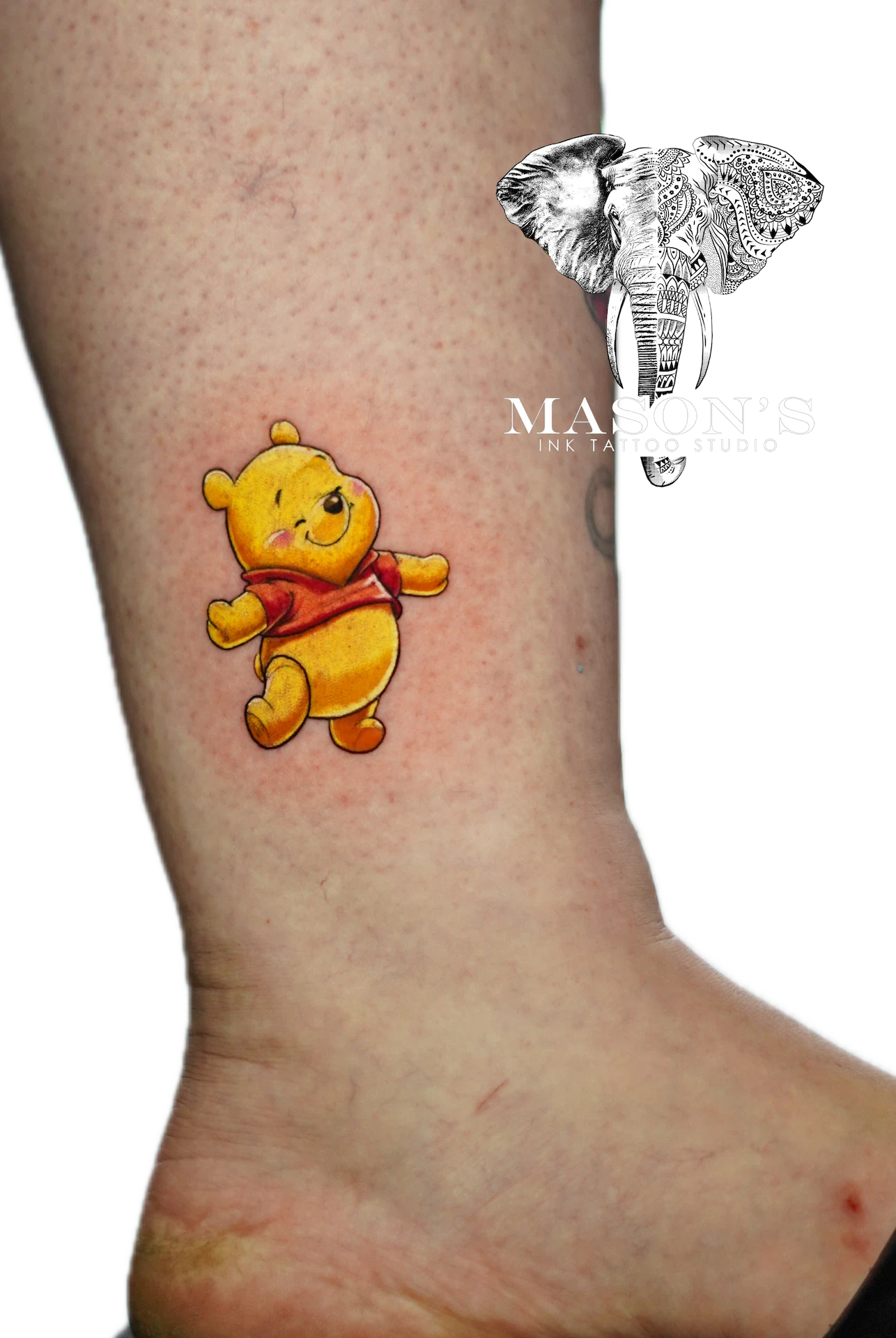 Color Winnie the Pooh Tattoo Design: Winnie the Pooh and an elephant mandala on the calf