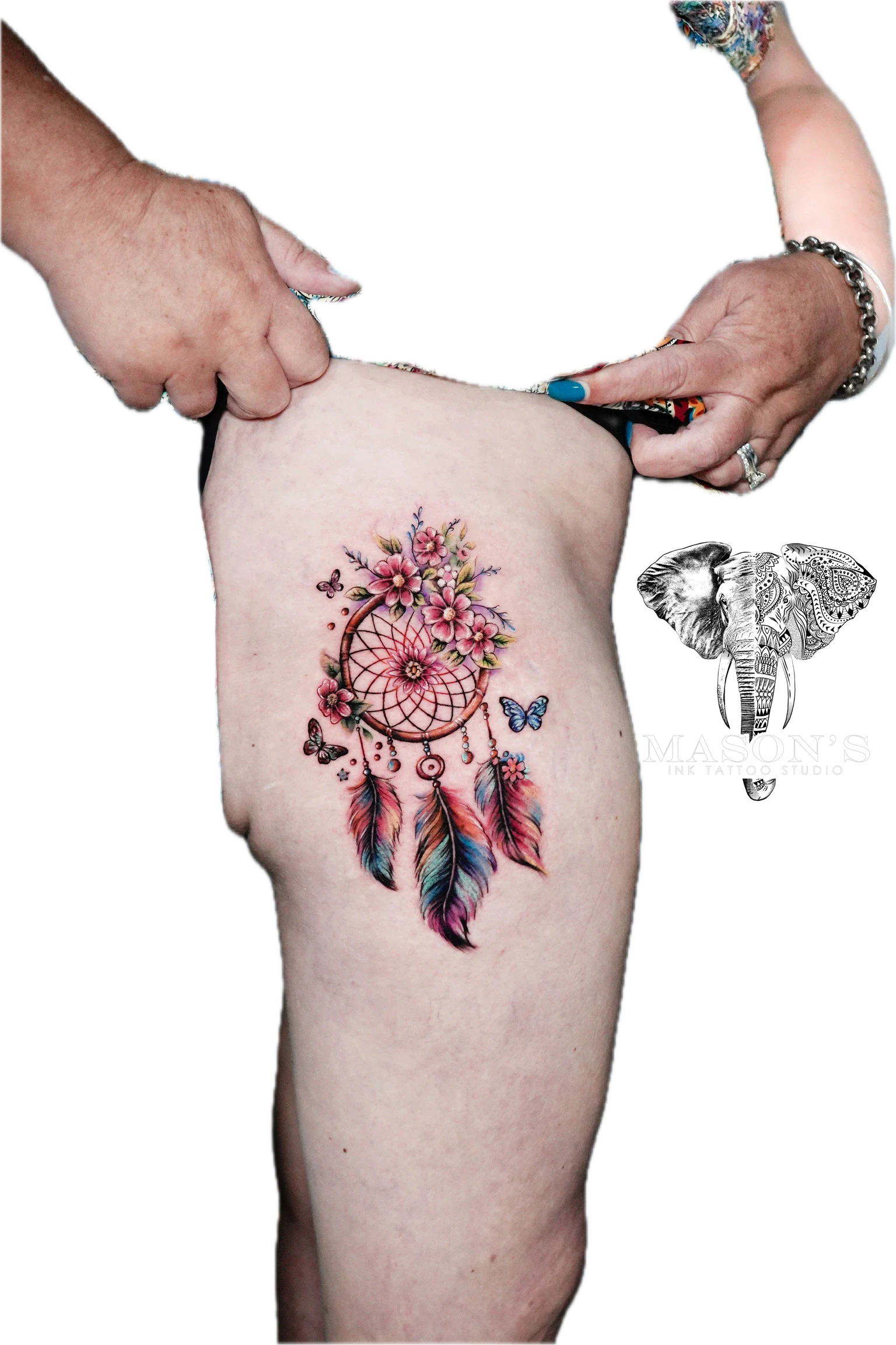 Color Tattoo Style Dream Catcher Design: a colorful dreamcatcher with flowers and butterflies on a thigh