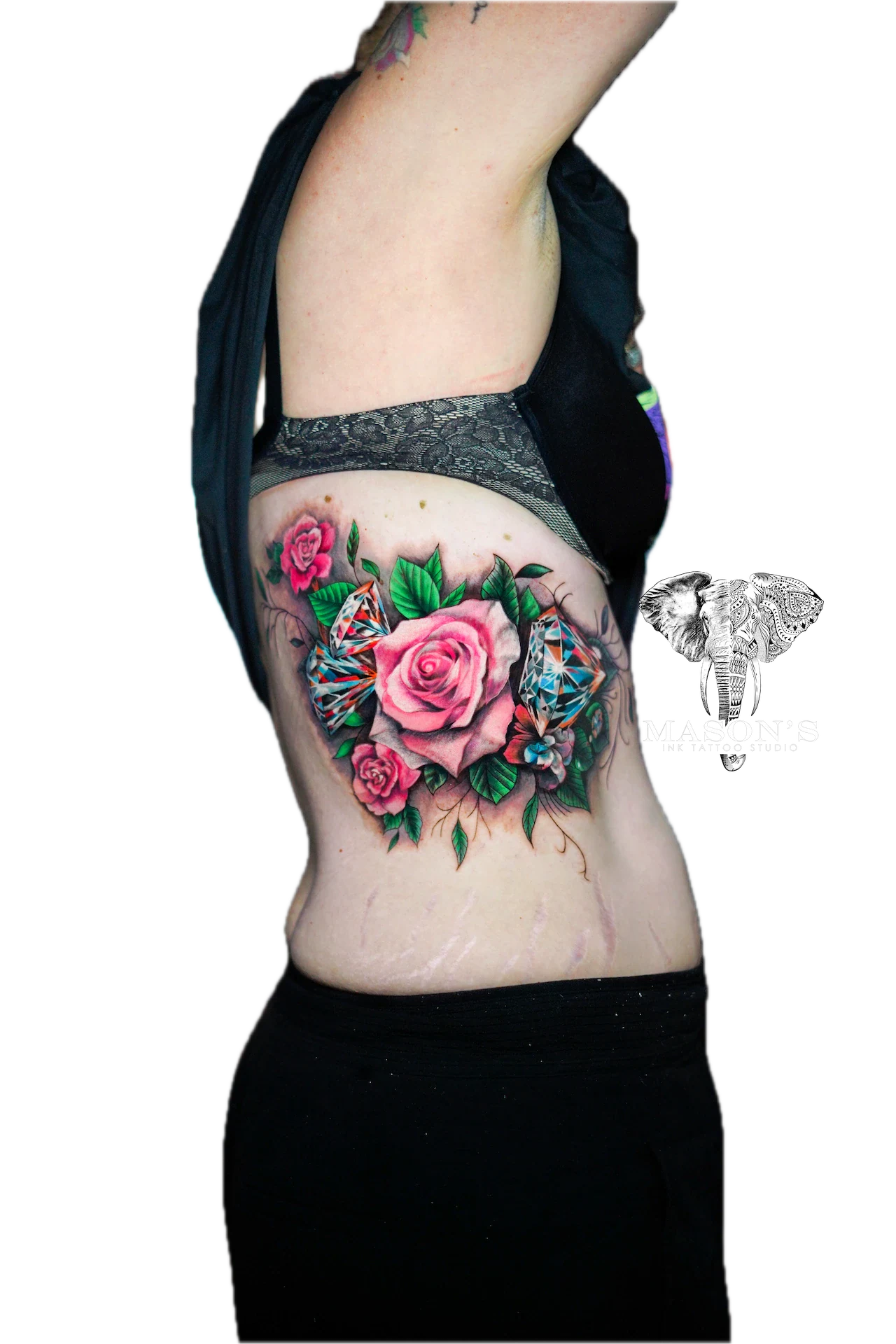 Color Tattoo Style Dream Catcher Design: a colorful rose and butterfly tattoo on the ribs