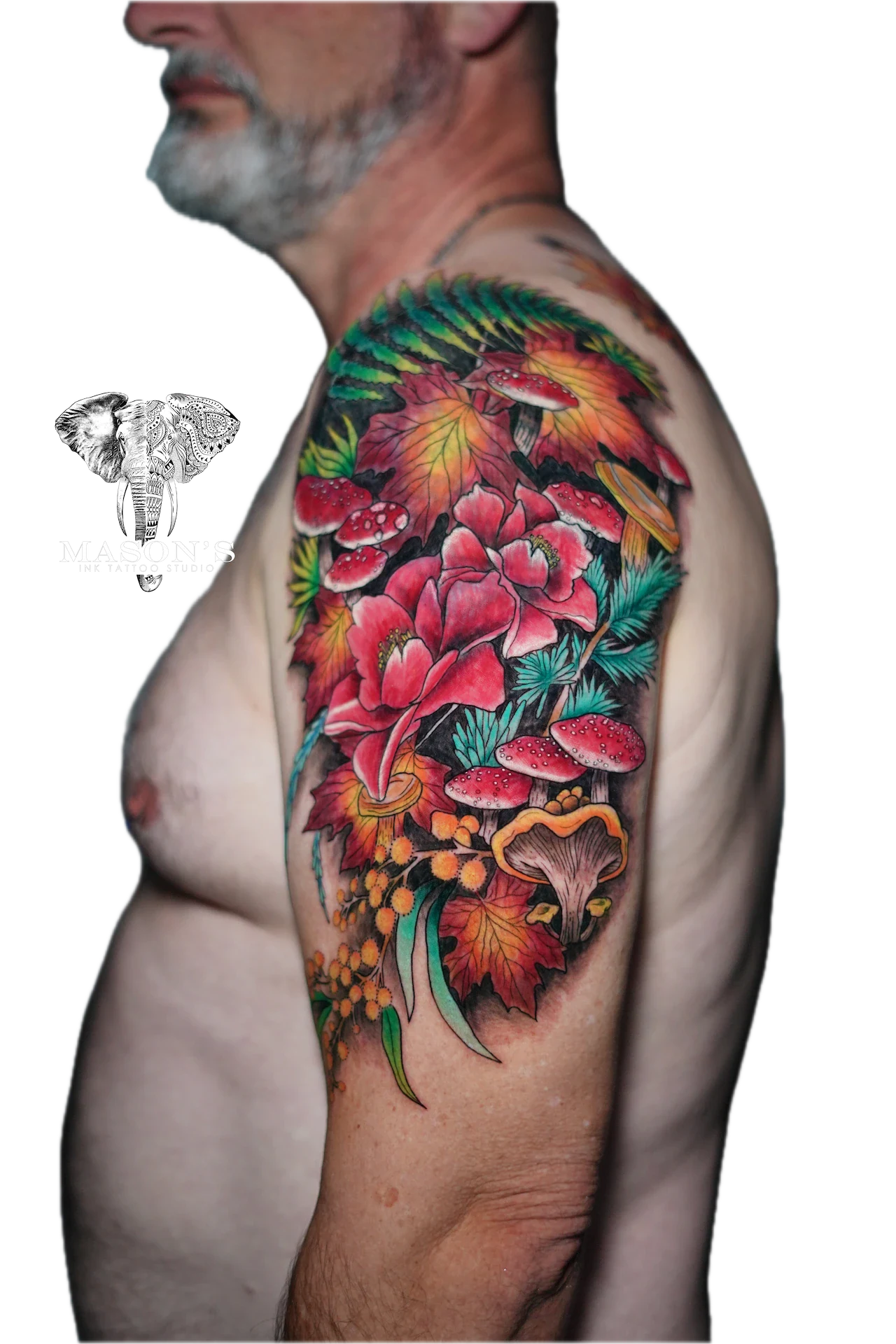 Colored Floral Tattoo Design: a vibrant floral and mushroom design on the upper arm