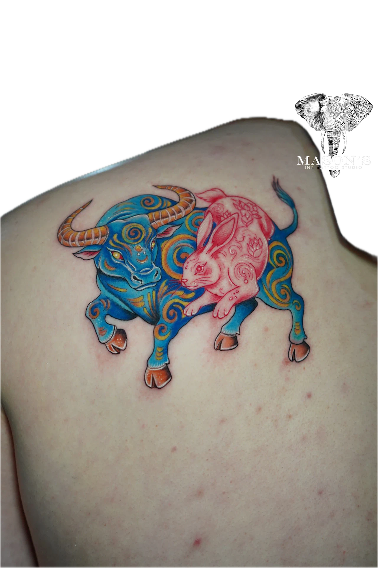 Color Tattoo Style Buffalo Design: a colorful bull and calf with intricate swirls and patterns