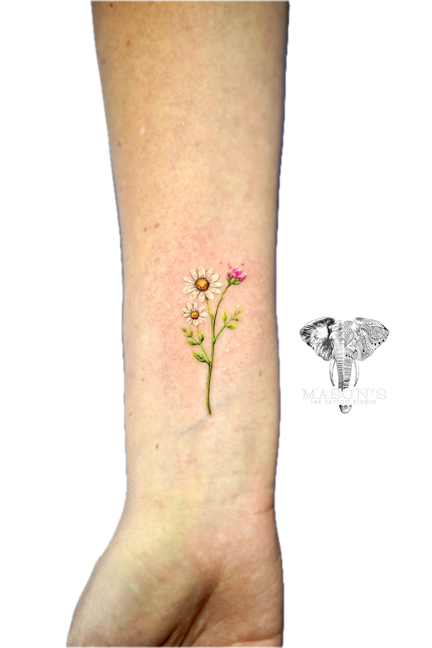 Color Floral Tattoo Design: Small colorful flowers on a stem on the calf